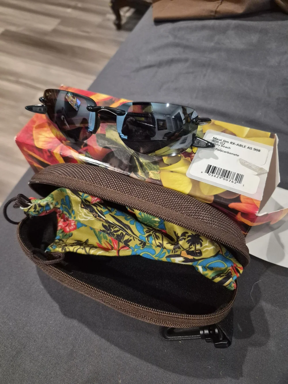 Maui Jim Polarized Rimless Sunglasses with Black Frames and Gray Lenses